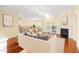 Bright and airy living room featuring hardwood floors, fireplace, and access to a dining area at 2 Poplar Ave, Elon, NC 27244