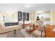 Cozy living room with hardwood floors, built-in bookshelves, and comfortable seating at 2 Poplar Ave, Elon, NC 27244