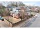 A backyard and exterior view of this home showcases its brick construction, and fenced-in yard at 201 W Trinity Ave, Durham, NC 27701