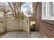 Side yard featuring a privacy fence and a stone walkway at 201 W Trinity Ave, Durham, NC 27701