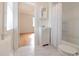 Clean bathroom with white tile floors, a shower-tub combo, and a vanity at 201 W Trinity Ave, Durham, NC 27701