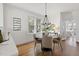 Charming dining room features a round table with seating for four and large windows at 201 W Trinity Ave, Durham, NC 27701