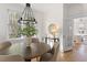 Bright dining room featuring hardwood floors, a round table, and elegant lighting at 201 W Trinity Ave, Durham, NC 27701