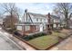 Charming two-story brick home with a manicured front yard at 201 W Trinity Ave, Durham, NC 27701