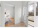 Hallway with an open front door and a view of the bedroom inside at 201 W Trinity Ave, Durham, NC 27701