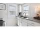 Bright kitchen showcasing granite countertops, a stainless steel sink, and ample storage space at 201 W Trinity Ave, Durham, NC 27701
