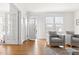 Sunlit living room featuring hardwood floors and cozy seating at 201 W Trinity Ave, Durham, NC 27701