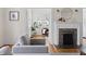 Cozy living room features a fireplace, hardwood floors, and a comfortable seating area at 201 W Trinity Ave, Durham, NC 27701