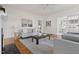 Cozy living room with hardwood floors, neutral tones, and ample natural light at 201 W Trinity Ave, Durham, NC 27701