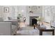 Bright living room with a fireplace and hardwood floors at 201 W Trinity Ave, Durham, NC 27701