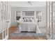 Bright main bedroom features hardwood floors, ceiling fan, and access to sitting area at 201 W Trinity Ave, Durham, NC 27701