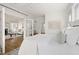 Bright main bedroom with hardwood floors, natural light, and views of living room at 201 W Trinity Ave, Durham, NC 27701