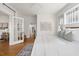 Bright main bedroom with hardwood floors, natural light, and stylish furnishings at 201 W Trinity Ave, Durham, NC 27701