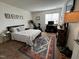 Inviting bedroom with patterned rug, full bed, and adjacent workspace bathed in natural light at 203 Oak Tree Dr, Chapel Hill, NC 27517