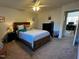 Spacious bedroom with ceiling fan, neutral palette, and queen bed flowing to the adjacent office at 203 Oak Tree Dr, Chapel Hill, NC 27517