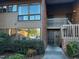 Exterior view of a multi-story townhome with brick facade and green landscaping at 203 Oak Tree Dr, Chapel Hill, NC 27517