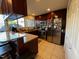 Well-lit kitchen featuring stainless steel appliances, granite counters, and cherry-wood cabinets at 203 Oak Tree Dr, Chapel Hill, NC 27517