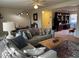Cozy living room featuring a comfortable sectional sofa and a brick fireplace at 203 Oak Tree Dr, Chapel Hill, NC 27517