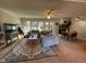 Relaxing living room area with fireplace, stylish rug, and lots of natural light at 203 Oak Tree Dr, Chapel Hill, NC 27517