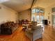 Spacious living room with hardwood floors, dining area, and large windows providing natural light at 203 Oak Tree Dr, Chapel Hill, NC 27517