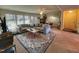 Bright living room featuring a large sectional, brick fireplace, and a stylish area rug at 203 Oak Tree Dr, Chapel Hill, NC 27517