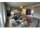 Comfortable living room with a gray sectional, brick fireplace, and ample natural light at 203 Oak Tree Dr, Chapel Hill, NC 27517