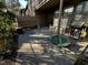 Exterior patio space with rocking chairs, grill, and dog bed at 203 Oak Tree Dr, Chapel Hill, NC 27517