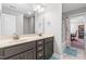 Bright bathroom with double vanity, gray cabinets, marble countertops and shower-tub combo at 238 Ashpole Trail, Clayton, NC 27520