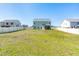 Vast backyard with grassy area and white privacy fence, offering ample space for outdoor enjoyment at 238 Ashpole Trail Trl, Clayton, NC 27520