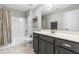 Bathroom featuring dark vanity, carpet tile flooring, shower and bath tub at 238 Ashpole Trail Trl, Clayton, NC 27520