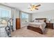 Bedroom featuring dark wood bed frame and furniture, two windows and carpet floors at 238 Ashpole Trail Trl, Clayton, NC 27520