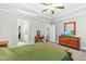 Bedroom boasts a ceiling fan with lighting, and a walk-in closet on a tile floor at 238 Ashpole Trail Trl, Clayton, NC 27520