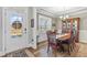 Formal dining room featuring hardwood floors, natural light, and elegant decor at 238 Ashpole Trail Trl, Clayton, NC 27520