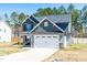 Beautiful two-story home featuring a two-car garage and a well-maintained front yard at 238 Ashpole Trail Trl, Clayton, NC 27520