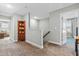 Hallway featuring neutral walls and carpet flooring leading to stairs and bedroom at 238 Ashpole Trail Trl, Clayton, NC 27520