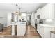 Bright kitchen featuring a center island, stainless steel appliances, and stylish white cabinetry at 238 Ashpole Trail Trl, Clayton, NC 27520