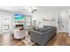 Inviting living room with a fireplace, comfortable seating, and a ceiling fan at 238 Ashpole Trail Trl, Clayton, NC 27520