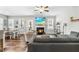 Cozy living room featuring a fireplace, comfortable seating, and an open connection to the dining area at 238 Ashpole Trail Trl, Clayton, NC 27520