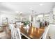 Open-concept living space flows from the dining area to the kitchen with an inviting atmosphere at 238 Ashpole Trail Trl, Clayton, NC 27520