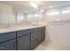 Bathroom features double sinks, large mirrors and medicine cabinets, and stone countertops at 267 Parkland Dr Dr, Pittsboro, NC 27312