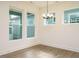 Bright dining room features hardwood floors, white walls and trim, and modern lighting at 267 Parkland Dr Dr, Pittsboro, NC 27312