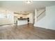 Spacious living room with wood-look floors, staircase, and an open layout perfect for entertaining at 267 Parkland Dr Dr, Pittsboro, NC 27312