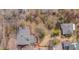 Overhead aerial view of a charming property featuring a well-maintained lawn and mature trees at 301 Hillsborough St, Chapel Hill, NC 27514