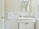 Bathroom with beadboard paneling, white vanity, and brushed nickel fixtures at 301 Hillsborough St, Chapel Hill, NC 27514
