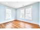 Inviting bedroom with natural light from large windows and classic white trim at 301 Hillsborough St, Chapel Hill, NC 27514