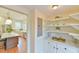 Butler's Pantry featuring white cabinets, open shelving, and a view into the kitchen at 301 Hillsborough St, Chapel Hill, NC 27514