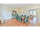 Dining room featuring hardwood floors, stylish decor, and seamless flow to the living spaces at 301 Hillsborough St, Chapel Hill, NC 27514