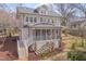 Two-story home with a screened-in porch and a tiered backyard with stone accents at 301 Hillsborough St, Chapel Hill, NC 27514