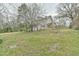 Charming two-story home with mature trees, a screened porch, and an outdoor pergola at 301 Hillsborough St, Chapel Hill, NC 27514