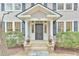Inviting entryway with decorative planters and sidelights at 301 Hillsborough St, Chapel Hill, NC 27514